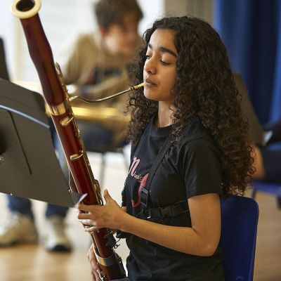 Young bassoon player and their instrument